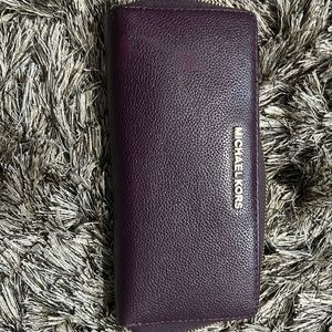 Burgundy Michael Kors wrap around wallet